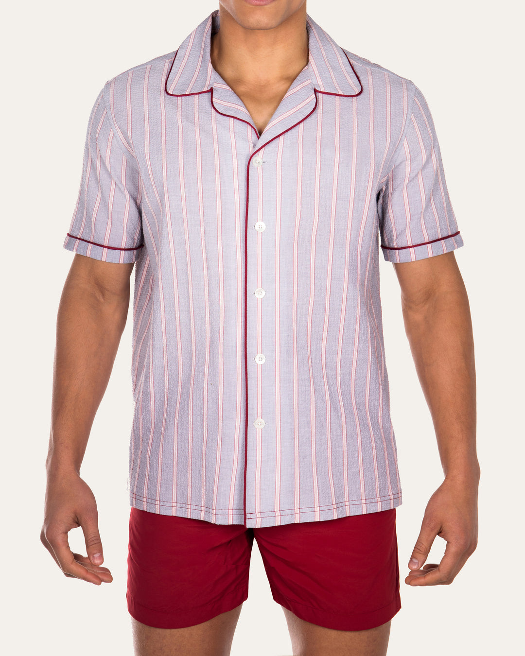 Luka Grey Shirt with Burgundy PipingCut from a breathable cotton seersucker fabric, the Luka  shirt is Inspired by the classic cuban shirt. Designed with a camp collar and burgundy contrasting piping.