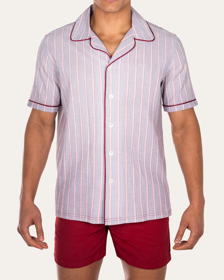 Luka Grey Shirt with Burgundy PipingCut from a breathable cotton seersucker fabric, the Luka  shirt is Inspired by the classic cuban shirt. Designed with a camp collar and burgundy contrasting piping.