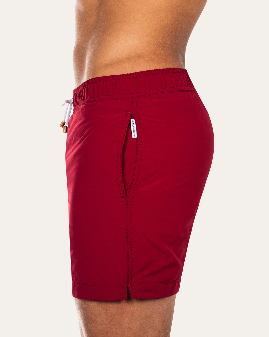 Easton Burgundy Mens Swim ShortsCut in a tailored silhouette and designed with an elasticated waistband, our mid-length Easton swim short  is our refined take on the classic swim shorts.
 Featuring