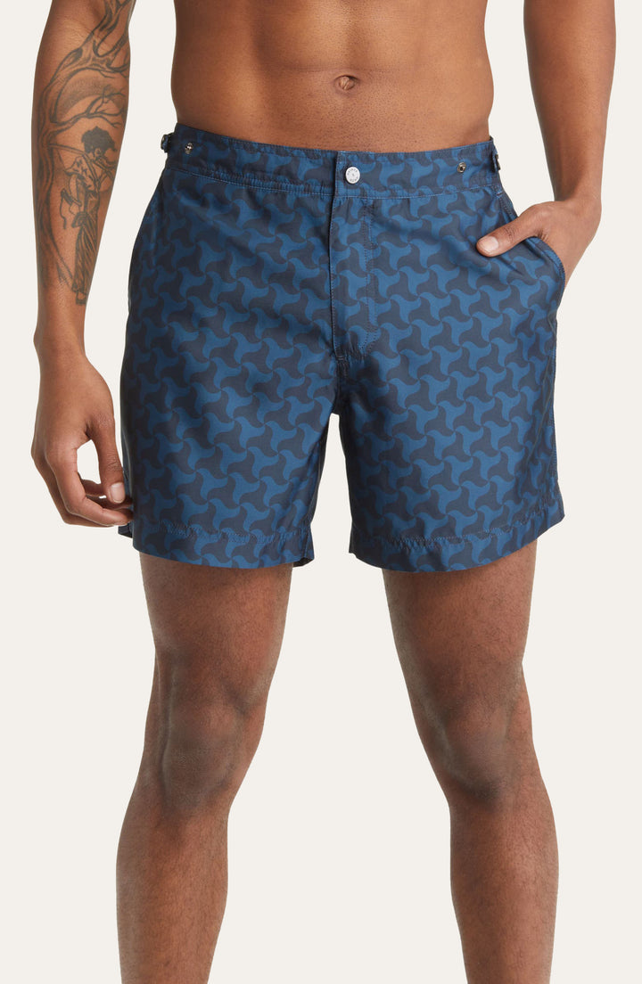 Model wearing Elvio tailored hybrid swim shorts  by Prince & Bond