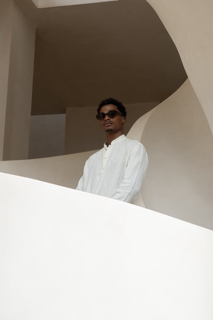 Prince & Bond resort wear framed by modernist architecture