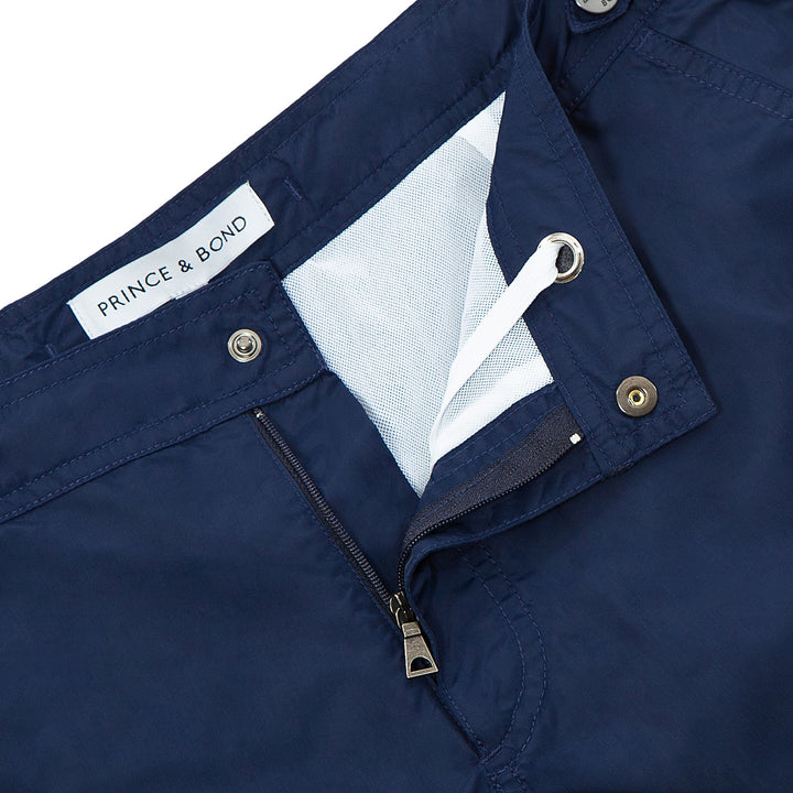 Elvio Blue Tailored Deep Sea Swim ShortCut in our signature Elvio silhouette, these hybrid swim shorts are made from quick drying breathable shell. 
An elevated take on the classic swim shorts, they featuswim shorts