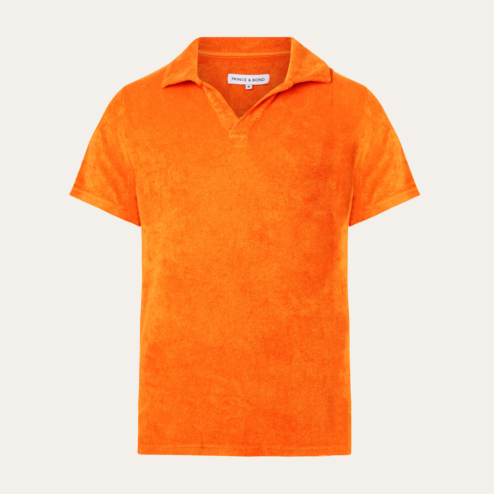 Orange organic terry cloth toweling polo
  
Cut from ultra-soft , breathable terry cloth and finished with an open placket, Sustainably and ethically crafted in Portugal.