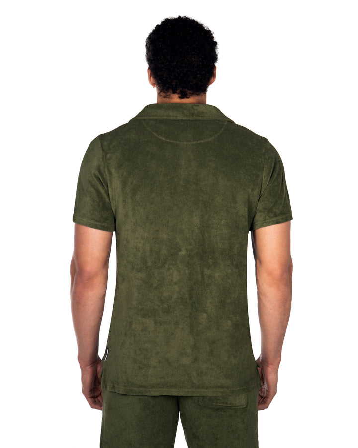 Riviera Terry Polo  
Cut from  organic terry toweling fabric that is soft and highly breathable, our Riviera polo is designed with an open placket which exudes effortless cool.
An Ide