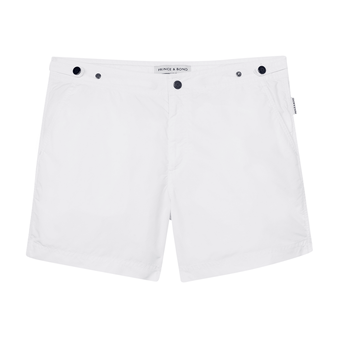 Elvio White Tailored Swim ShortCut in our signature Elvio silhouette, these hybrid swim shorts are made from quick drying breathable shell . 
An elevated take on the classic swim shorts, they featswim shorts
