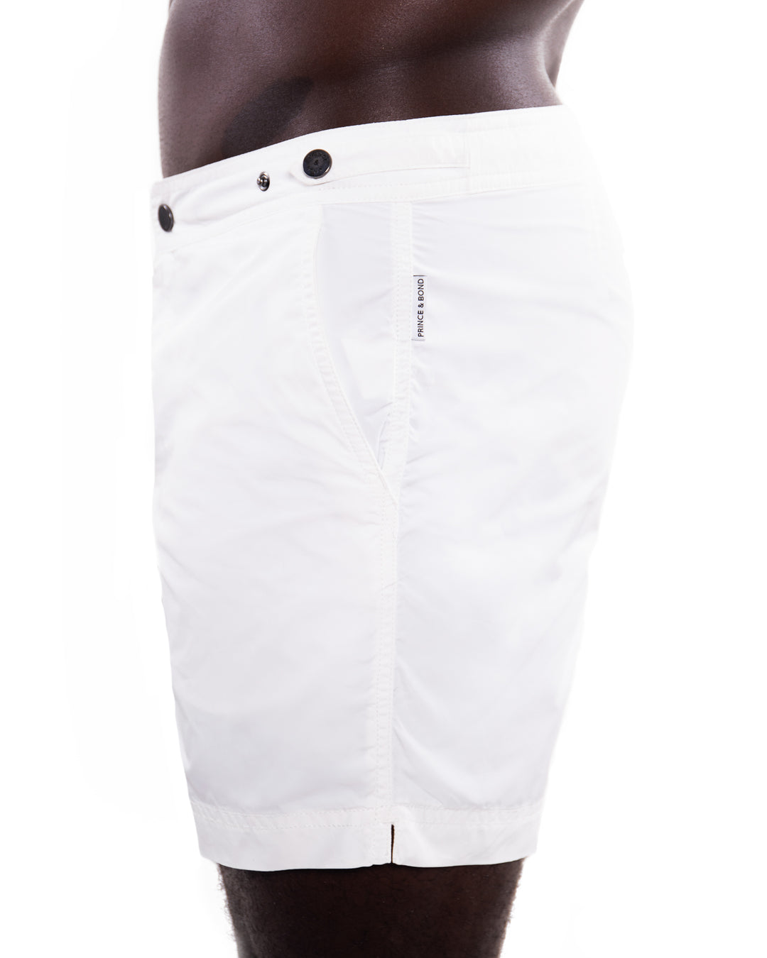 Elvio White Tailored Swim ShortCut in our signature Elvio silhouette, these hybrid swim shorts are made from quick drying breathable shell . 
An elevated take on the classic swim shorts, they featswim shorts